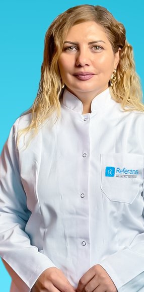 Dr. İnci Şabanlı Referans Medical Group həkim xalatında